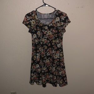 It is a small and the colors consist of black, off white, and peach.